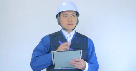 Japanese construction man checking safety list negative response   Vídeo Stock 63431976