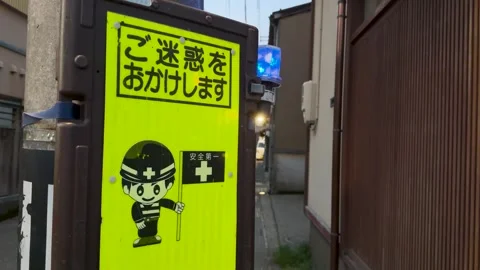 Japanese Construction Safety Sign with Cartoon Worker in Kanazawa Alley Stock Footage 345014553