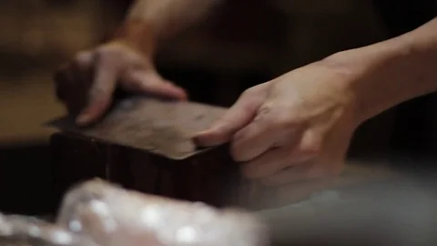 Japanese Cooking Knife being Sharpened on Block in Asian Kitchen. Slow Motion Stock Footage 85293776
