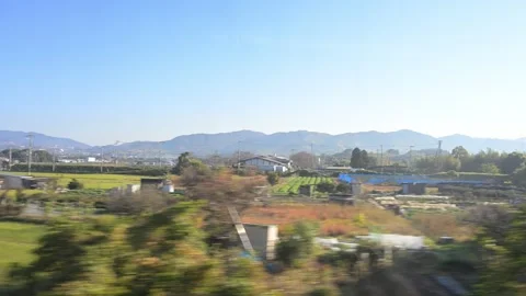 Japanese countryside passing by train window 스톡 동영상 305411985