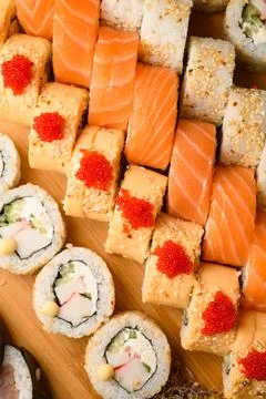 Japanese cuisine set of maki sushi rolls with tuna, tobiko caviar, salmon, cream Stock Photos