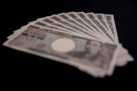 Japanese currency 100,000 yen on the black background Stock Photos
