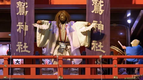 Japanese dancer with an eagle mask making a dance at festival of the rooster. Stock Footage 141967968