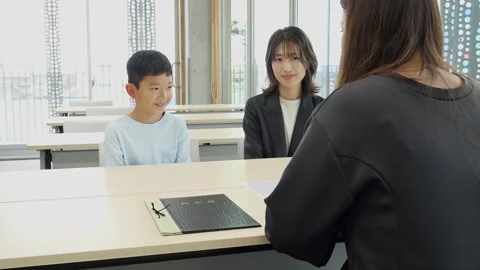 Japanese Elementary School Boy Attending School Interview with His Mother Stock Footage 344095725