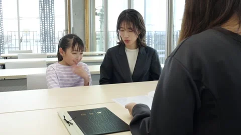 Japanese Elementary School Boy Attending School Interview with His Mother Stock-Footage 344096128