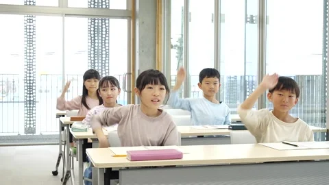 Japanese Elementary School Students Raising Hands in Classroom Stock-Footage 344093725