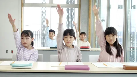 Japanese Elementary School Students Raising Hands in Classroom Stock-Footage 344094048