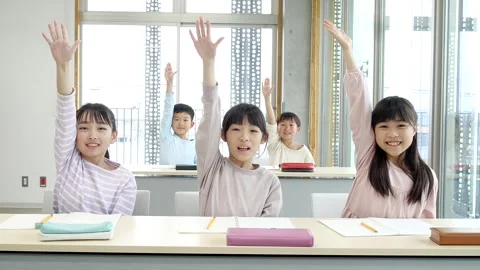 Japanese Elementary School Students Raising Hands in Classroom Stock-Footage 344094246
