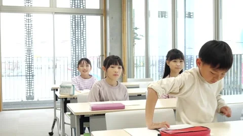 Japanese Elementary School Students Raising Hands in Classroom Stock-Footage 344094259