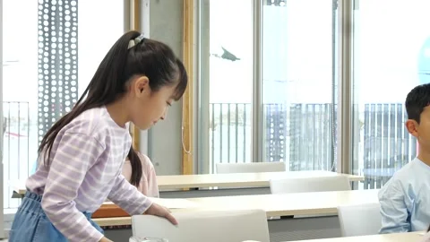 Japanese Elementary School Students Raising Hands in Classroom Stock-Footage 344094438