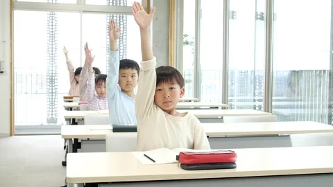 Japanese Elementary School Students Raising Hands in Classroom Stock-Footage 344095264