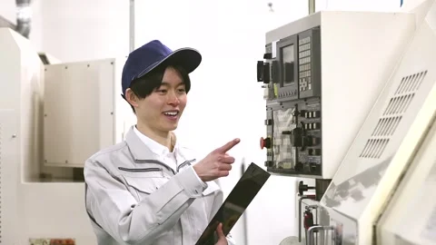 Japanese Factory Worker Operating CNC Machine Control Panel Stock-Footage 344212910