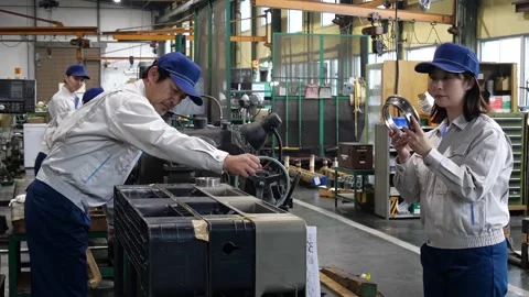 Japanese Factory Workers Inspecting Precision Lathe Machined Part Stock-Footage 344062407
