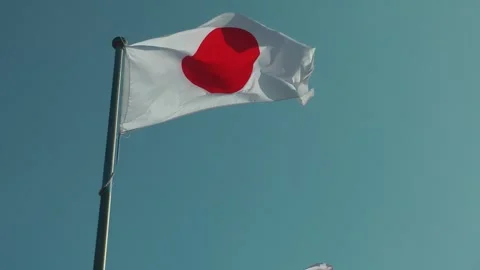 A Japanese flag is flying Видео 343386614