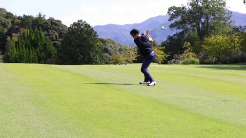 Japanese Golfer Hitting Second Shot with Fairway Wood on a Par 5 Hole 스톡 동영상 344132898