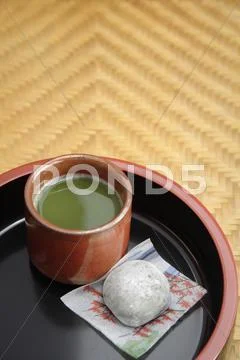 Japanese green matcha tea and mochi sweet on tray Stock Photos