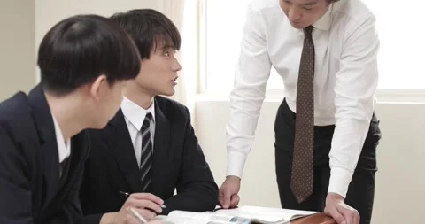 Japanese junior-high school students studying with teacher in the classroom Stock Footage 163001429