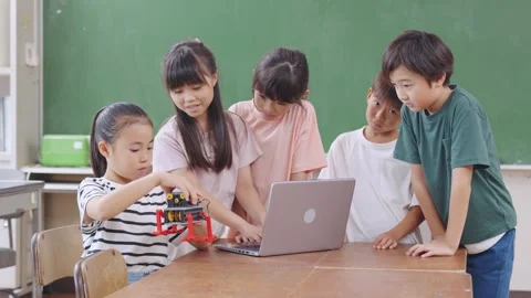 Japanese kids studying in the class Stock Footage 297820056