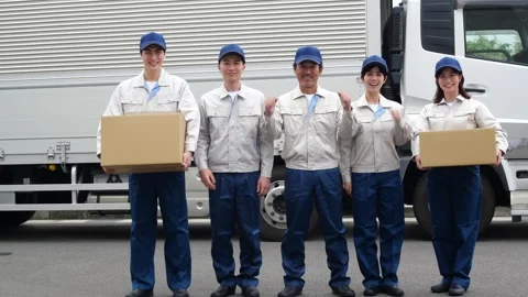 Japanese Logistics Workers Standing Together in Front of Delivery Truck Stock Footage 344060816