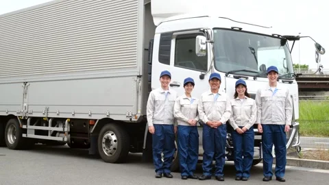 Japanese Logistics Workers Standing Together in Front of Delivery Truck Stock-Footage 344060866