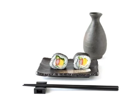 Japanese maki rolls, chopsticks and vessel with isolated background Stock Photos