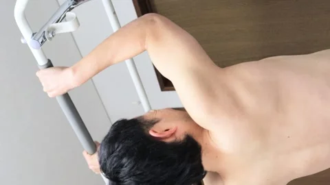 Japanese man doing pull-ups naked Stock Footage 336626727