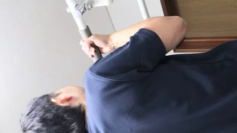 Japanese man doing pull-ups Stock Footage 336631332