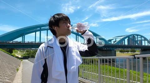 JAPANESE MAN drinking water. Stock Photos