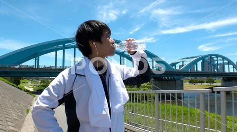 JAPANESE MAN drinking water. Stock Photos