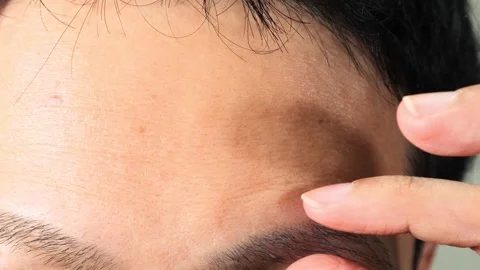 Japanese man pulling his eyebrows Stock Footage 336637367