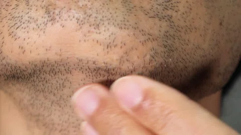 Japanese man touching his beard Stock Footage 336563044