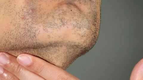 Japanese man touching his beard Stock Footage 336564594