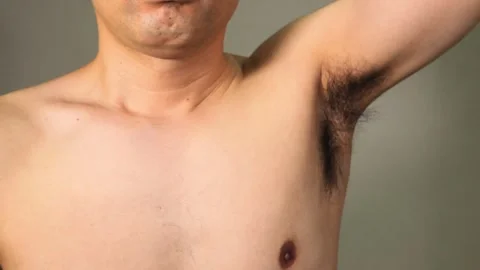 Japanese men taking measures to combat underarm odor Stock Footage 336639751
