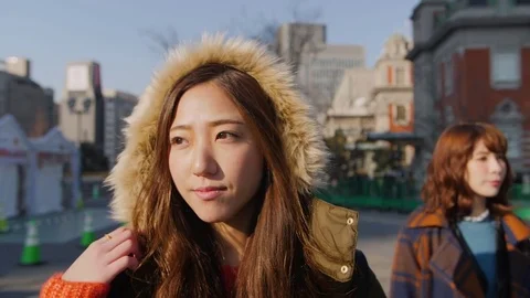 Japanese models walking through Osaka city Hall location low motion  스톡 동영상 84874787