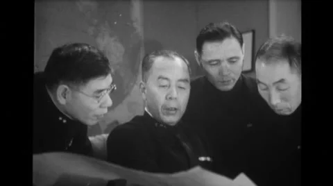 Japanese naval officials discussing while looking at map Stock Footage 37595135