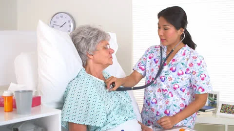 Japanese nurse performing a basic checkup 스톡 동영상 25542700