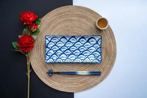 Japanese or Chinese table setting with traditional dinnerware. Stock Photos