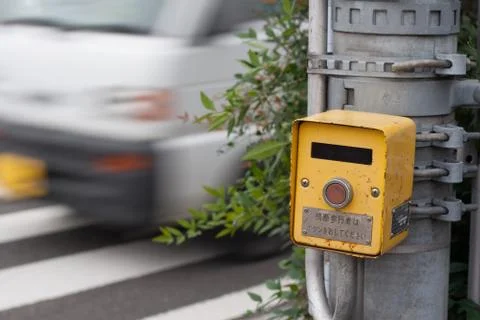 Japanese pedestrian control signal as a car passing by Stock Photos