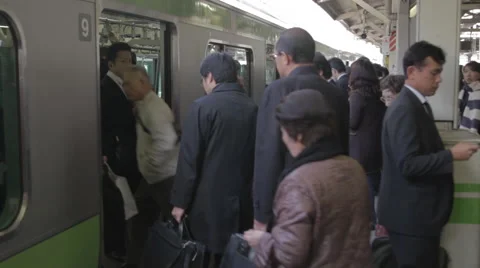 Japanese People enter Train in Train Station Stock Footage 52627132