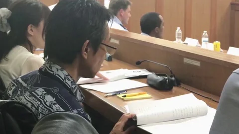 Japanese prosecuters read notes during U.S. military mock trial Stock-Footage 91729930