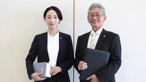 Japanese Prosecutors Standing with Case Files and Smiling 스톡 동영상 344280942