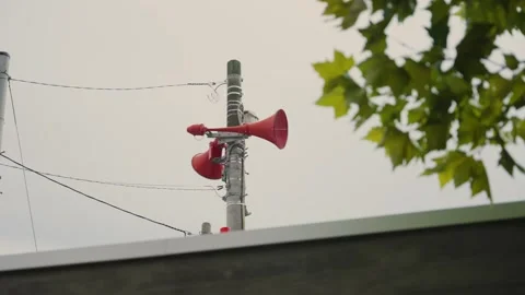 Japanese public address system broadcasting announcements in city or town Stock Footage 340920818