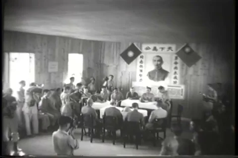 Japanese representatives sit and the table being photographed - 1945 Stock Footage 93844237