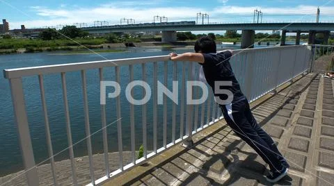 JAPANESE RUNNER MAN doing push ups. Stock Photos