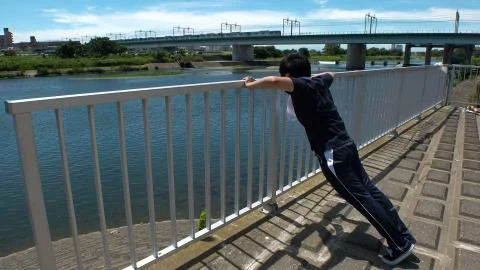 JAPANESE RUNNER MAN doing push ups. Stock Photos