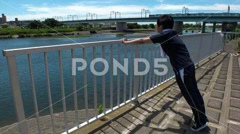 JAPANESE RUNNER MAN doing push ups. Stock Photos