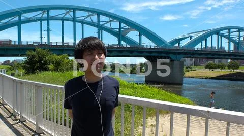 JAPANESE RUNNER MAN doing some stretches. Stock Photos