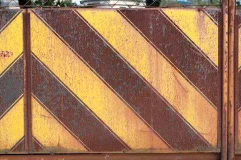 Japanese rusty yellow and black stripe patterned metal wall Stock Photos