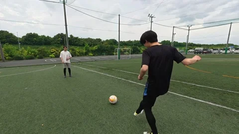 Japanese Soccer Coach Practicing Passing Drill on Outdoor Futsal Court Stock-Footage 344241673