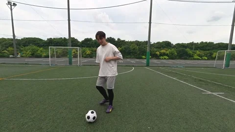 Japanese Soccer Coach Practicing Passing Drill on Outdoor Futsal Court Stock-Footage 344241934